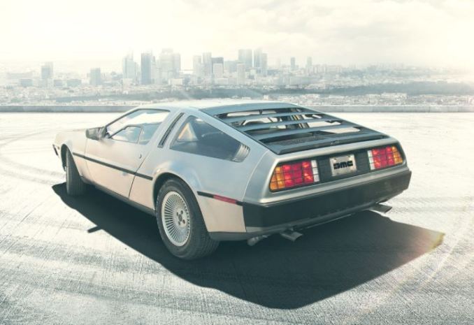 New DeLorean, viewed from behind, with a city skyline in the background.